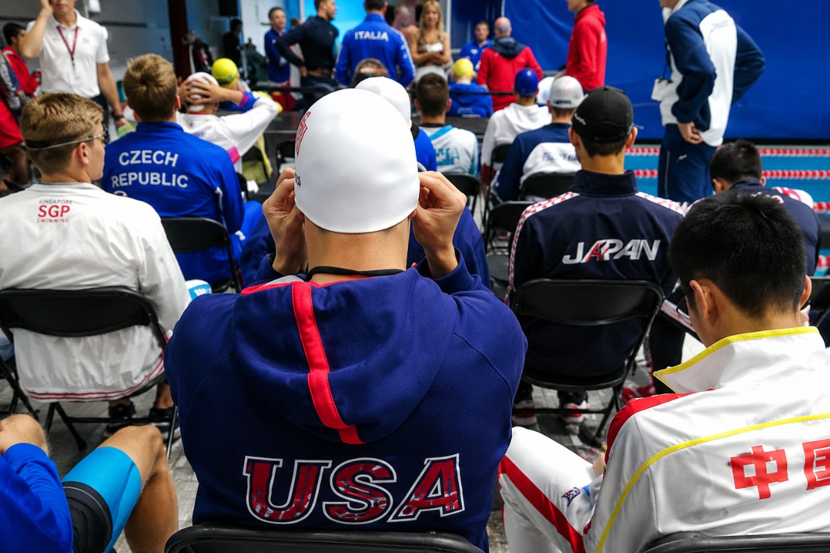 Focused swimmer behind the starting blocks